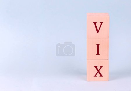 Photo for CBOE Volatility Index, or VIX, on wooden cubes on blue background - Royalty Free Image