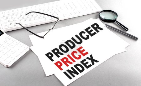 Photo for PRODUCER PRICE INDEX text on paper with keyboard, calculator on a grey background - Royalty Free Image