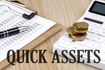 Photo for QUICK ASSETS text with chart and calculator and coins , business - Royalty Free Image