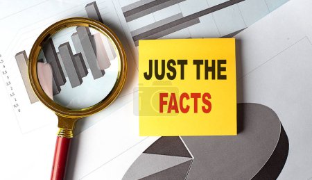 Photo for JUST THE FACTS text on sticky on chart - Royalty Free Image