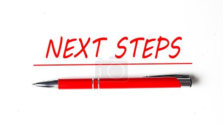 Text NEXT STEPS with ped pen on white background