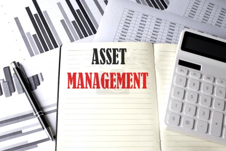 ASSET MANAGEMENT text written on notebook on chart and diagram