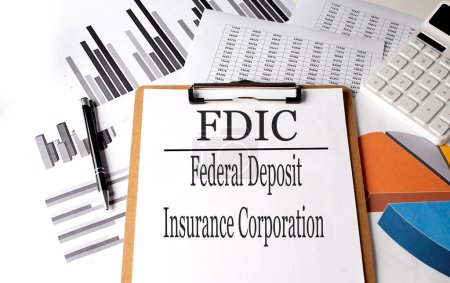 Photo for Paper with FDIC federal deposit insurance corporation on a chart background - Royalty Free Image