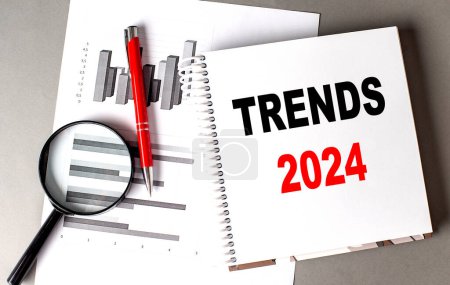 Photo for TRENDS 2024 text written on a notebook with chart - Royalty Free Image