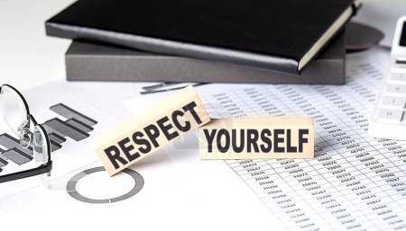 Photo for RESPECT YOURSELF - text on wooden block with chart and notebook - Royalty Free Image