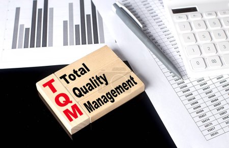 Photo for Word TQM made with wood building blocks, business - Royalty Free Image
