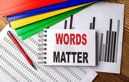 Photo for WORDS MATTER text on notebook with pen, folder on a chart background - Royalty Free Image