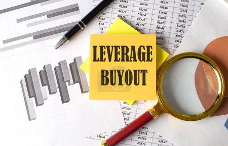 Photo for LEVERAGE BUYOUT text on sticky on the graph background with pen and magnifier - Royalty Free Image