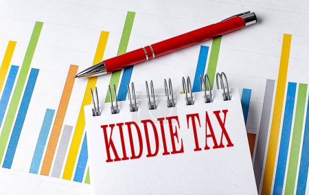 KIDDIE TAX text on notebook with chart and pen business concept