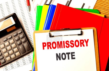 PROMISSORY NOTE text written on a paper clipboard with chart and calculator