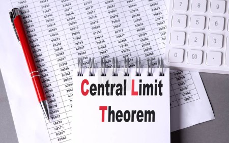 CENTRAL LIMIT THEOREM text on a notebook with chart , pen and calculator. 