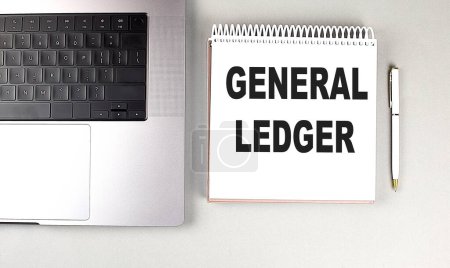 GENERAL LEDGER text on a notebook with laptop and pen . 
