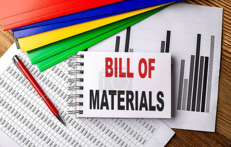BILL OF MATERIALS text on a notebook with folder on chart. 