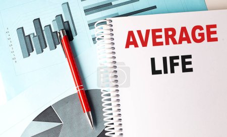 AVERAGE LIFE text on a notebook on chart background . 