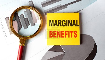 MARGINAL BENEFITS text on a sticky on chart background . 