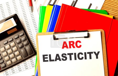 ARC ELASTICITY text on a clipboard with calculator and color folder . 