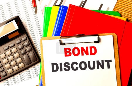 BOND DISCOUNT text on a clipboard with calculator and color folder . 