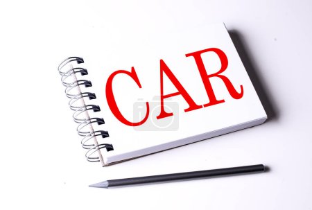 CAR word on a notebook on white background 