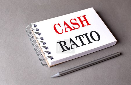 CASH RATIO text on a notebook on grey background 