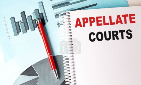 APPELLATE COURTS text on a notebook on chart background .