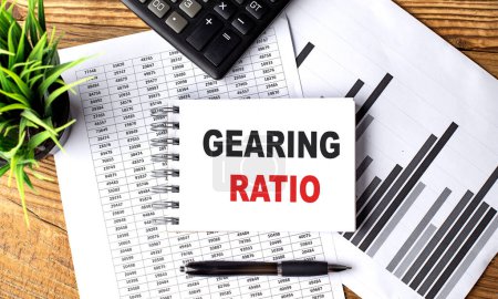 GEARING RATIO text on a notebook on chart with calculator and pen . 