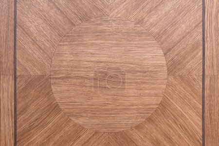 Wooden tabletop made from solid oak and oak veneer of marquetry technique with clear varnish finish as background