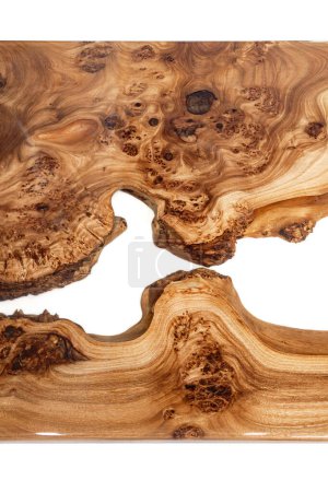 Live edge elm burl slab table top with central epoxy resin river on white background, top view of fragment elm epoxy table