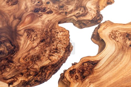 Live edge elm burl slab table top with central epoxy resin river on white background, combining natural wood with a synthetic material close view