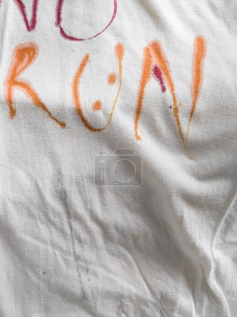 Photo for Writing Yes, No and Run on T-Shirt with Ink - Royalty Free Image