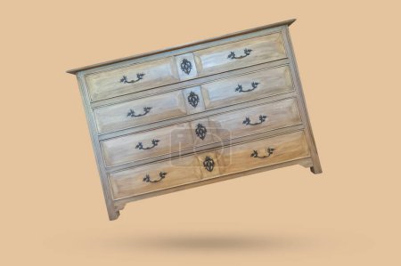 Old vintage wooden chest drawer floated on brown background