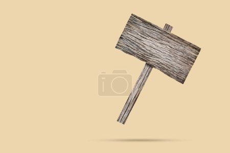 Téléchargez les photos : Vieil enseigne en bois flottant sur fond brun - en image libre de droit