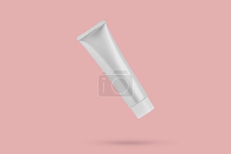 Blank cosmetic tube mockup isolated on pink background
