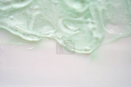 Photo for Transparent clear green liquid serum gel cosmetic texture background - Royalty Free Image