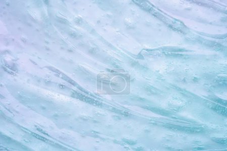 Gel líquido transparente azul claro textura cosmética fondo