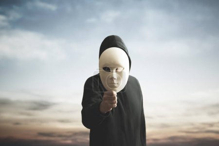 Photo for Surreal image of man hiding behind a mask, concept of identity crisis - Royalty Free Image