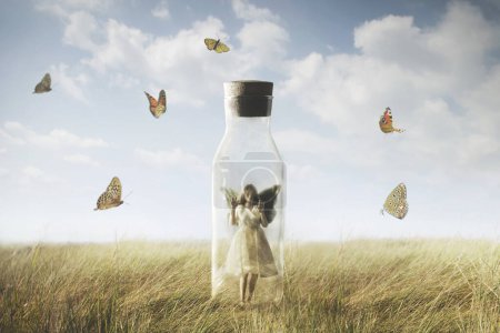 Photo for The surreal butterfly woman looking at the freedom enclosed in a bottle, abstract concept - Royalty Free Image