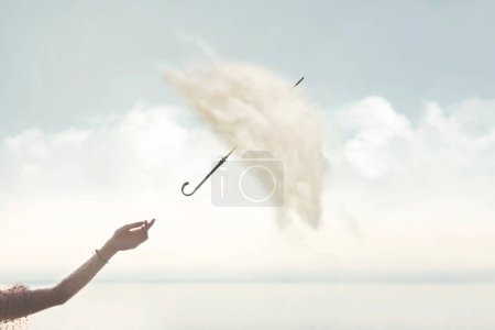mano de mujer libera un paraguas surrealista con cubierta hecha de nubes