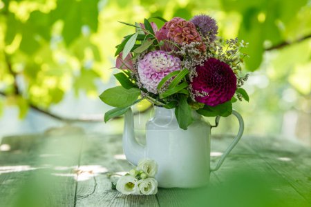 Romantic bouquet on a wooden table with nature background
