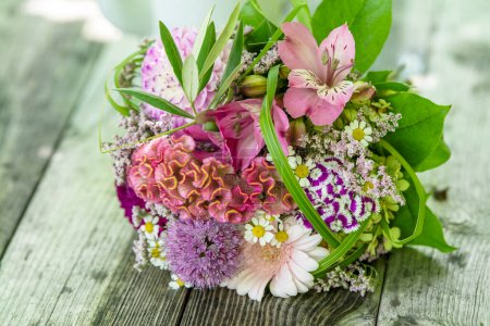 Photo for Romantic bouquet on a wooden table with nature background - Royalty Free Image