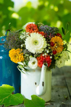 Photo for Colorful flower bouquet on a garden table - Royalty Free Image