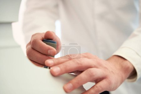 Photo for Cropped head portrait of doctor hands is operating the modern eyesight machine in the clinic - Royalty Free Image