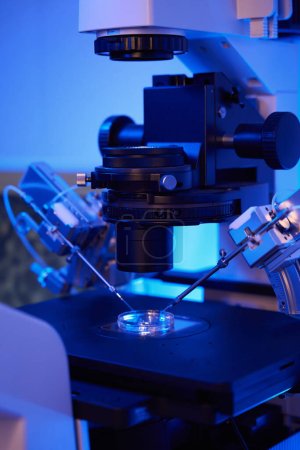 Photo for Closeup of ICSI setup with inverted microscope equipped with micromanipulators and microinjectors - Royalty Free Image