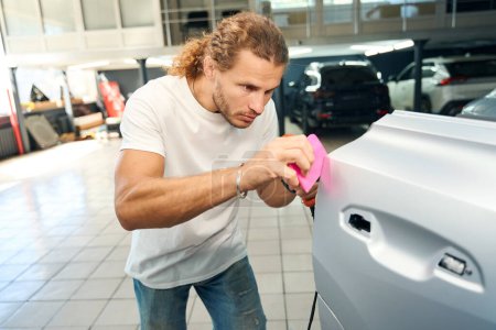 Master uses an industrial dryer when detailing a car, he glues anti-gravel film to the car doors