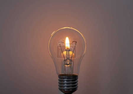Photo for Candle on light bulb.Blackout, electricity off, energy crisis or power outage, concept image. - Royalty Free Image