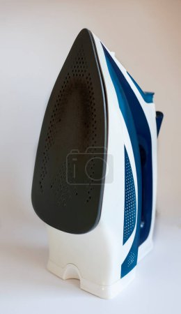 Photo for Used dirty iron not suitable for ironing. home appliance service concept - Royalty Free Image