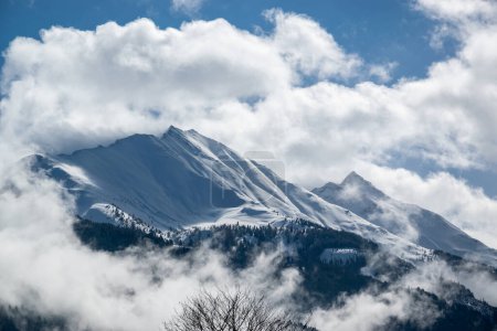 Photo for Snow covered rock of the Austrian Alps in winter in the clouds. - Royalty Free Image