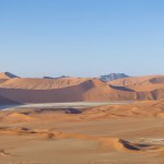Drone panorama over the Sossusvlei and the surrounding dunes of the Namib Desert in Namibia during the day in summer