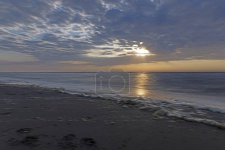 Panoramic picture over the beach of Ouddorp in Holland in the evening during sunset in summer