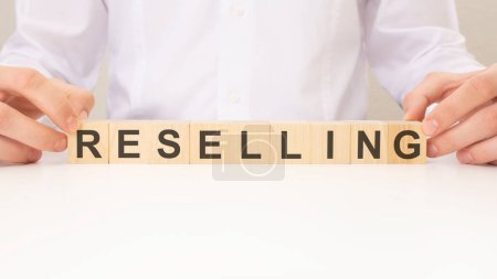 RESELLER word made with wooden building blocks. Business and sell concept