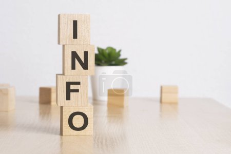 word INFO with wood cubes, white background